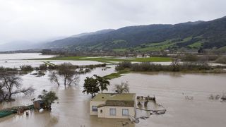 Floodwaters surrounding a home in California on January 13.